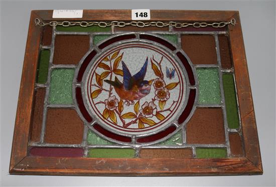 Framed 19thC stained glass panel of a bird